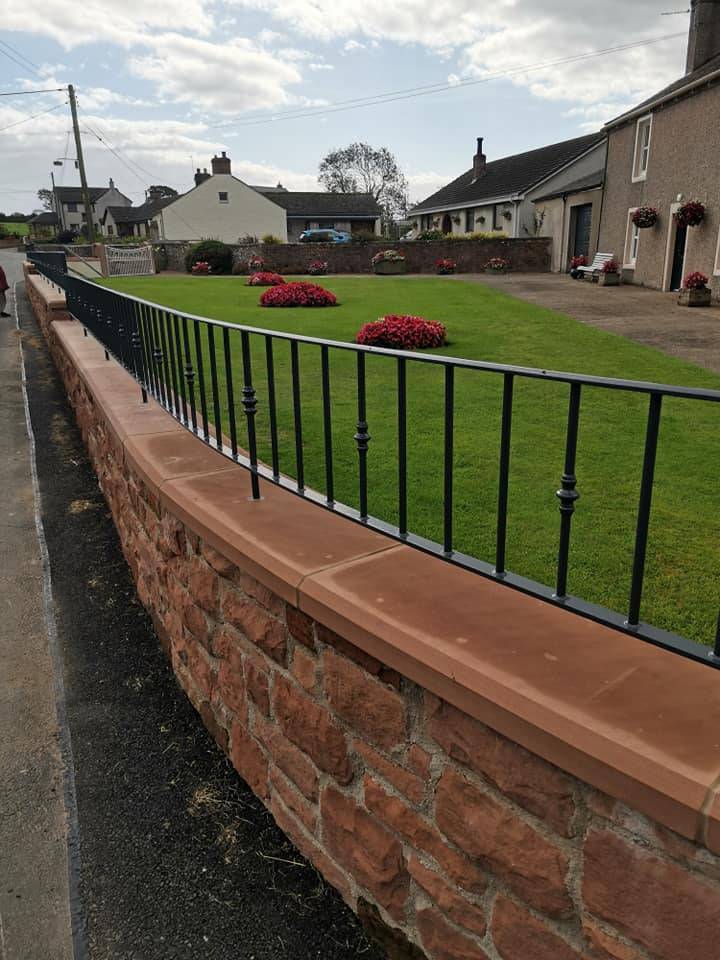 Curved wall top railing installed on sandstone wall at Lessonhall near Wigton Cumbria