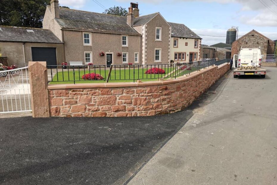 Anthracite grey curved wall top railing installed on sandstone wall near Wigton Cumbria