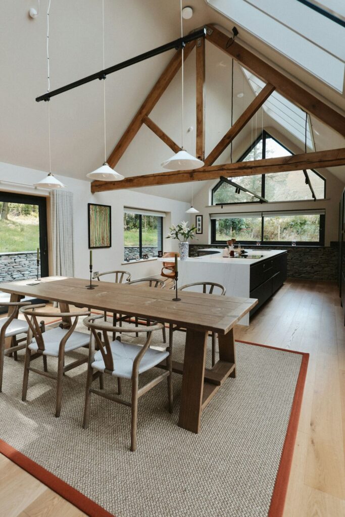 Open plan interior space within Lake District home supported by structural steel framework